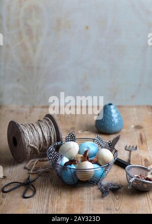 Easter eggs in wire basket Stock Photo