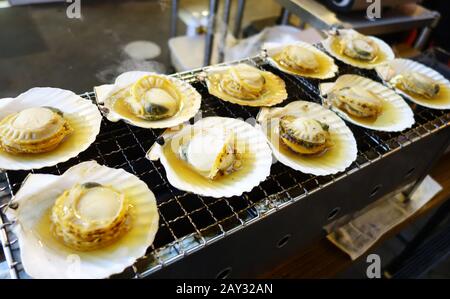 Cooking scallops on the grill Stock Photo