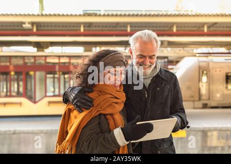 Mature couple using digital tablet Stock Photo