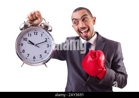 Angry businessman hitting clock isolated on white Stock Photo