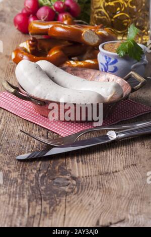Bavarian veal sausage in a copper pot Stock Photo