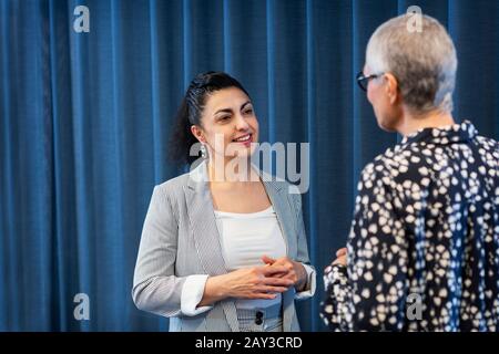 Businesswomen talking together Stock Photo