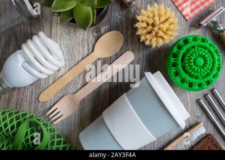 Flat Lay Shot Of Plastic Free Eco Products With Reusable Or Sustainable Zero Waste Products On Wooden Background With Metal Staws Wooden Cutlery Paper Stock Photo