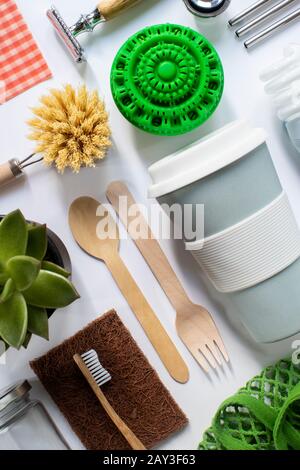 Flat Lay Shot Of Plastic Free Eco Products With Reusable Or Sustainable Zero Waste Products On Wooden Background With Metal Staws Wooden Cutlery Paper Stock Photo