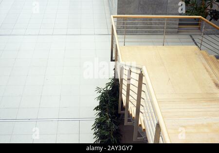 Stairs in a convention center with green trees indoor Stock Photo