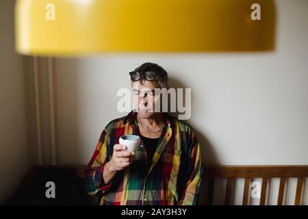 Man at table looking away Stock Photo