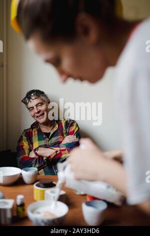 Smiling man at table Stock Photo