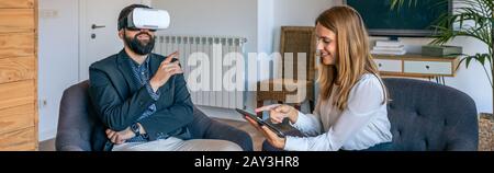 Businessman using virtual reality glasses Stock Photo
