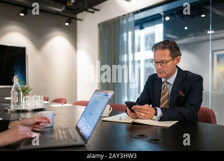 Mature businessman using cell phone Stock Photo