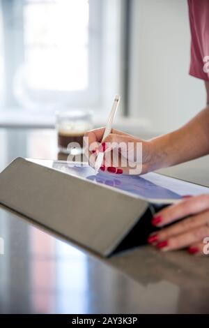 Hands using digital tablet Stock Photo