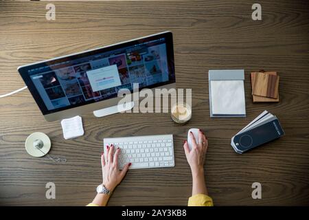Hands using desktop PC Stock Photo