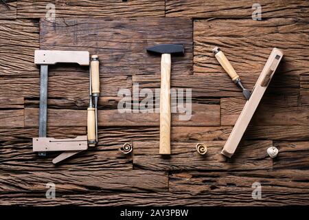 DIY Word Made Up Of Different Worktools On Wooden Surface Stock Photo