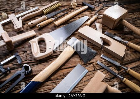 Various Carpenter Tools From Toolkit Laying On Desk Stock Photo