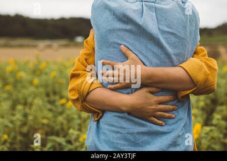 Couple hugging, mid section Stock Photo