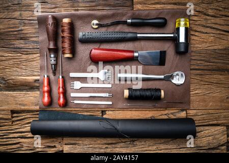 Leather Craft Tools On Desk In Tailoring Workshop Stock Photo
