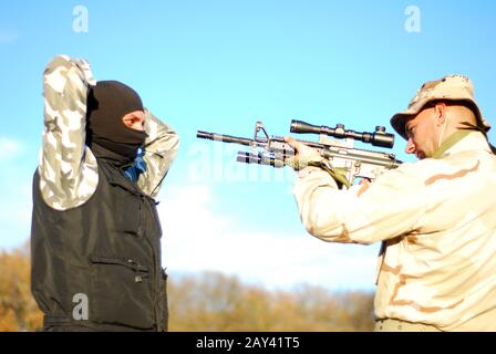 soldier aiming terrorist Stock Photo