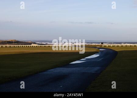 ST ANDREWS, SCOTLAND - 13/2/2020 - The road across the old course with a view of west sands in the background Stock Photo