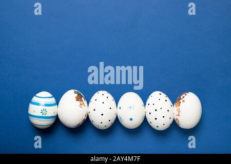 Easter eggs on a blue background, Place for text, Top view, Stock Photo