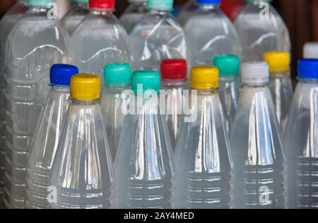 Plastic bottles with colourful caps. Stock Photo