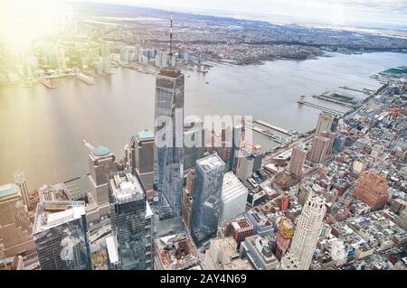 New York City from helicopter point of view. Downtown Manhattan skyscrapers on a cloudy day. Stock Photo