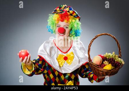 Clown with fruits in funny concept Stock Photo