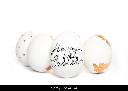 Easter eggs on a white background, place for text, top view, isolation, four Stock Photo