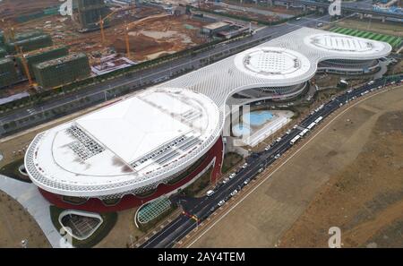 Wuhan. 14th Feb, 2020. Aerial photo taken on Feb. 14, 2020 shows a view of Jiangxia temporary hospital in Wuhan, capital city of central China's Hubei Province. Jiangxia temporary hospital, a 400-bed hospital converted from an outdoor sports center, started to receive COVID-19 patients with mild symptoms on Friday. The hospital is the first temporary hospital that mainly adopt Traditional Chinese medicines (TCM) to treat the patients. Credit: Cheng Min/Xinhua/Alamy Live News Stock Photo