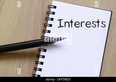 Interests write on notebook Stock Photo