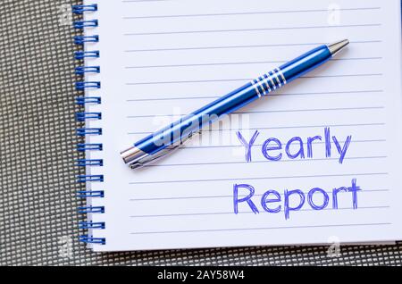 Yearly report write on notebook Stock Photo