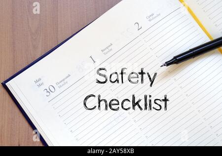 Safety checklist write on notebook Stock Photo