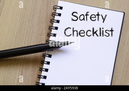 Safety checklist write on notebook Stock Photo