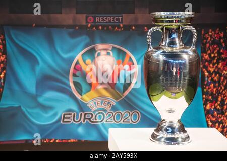 Original UEFA European Championship Trophy with stadium background and logo EURO 2020 Stock Photo