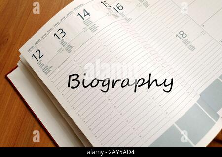 Biography write on notebook Stock Photo