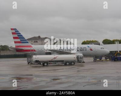 Baltimore, Maryland- September 2017: Medium wide shot of an American Airlines aircraft loads passengers at the Baltimore Washington International Thur Stock Photo