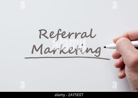 Referral marketing written on whiteboard Stock Photo