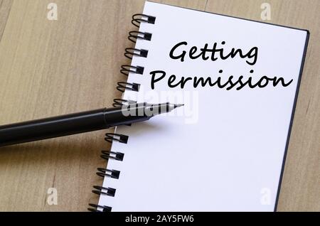 Getting permission write on notebook Stock Photo