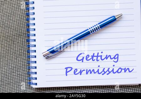 Getting permission write on notebook Stock Photo