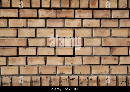 Old vintage brick wall background texture with yellow and red brick Stock Photo