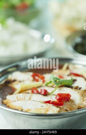 Indian chicken curry in metal bowls Stock Photo