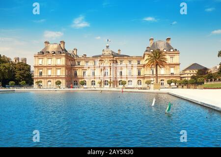 26 July 2019, Paris, France: Luxembourg Palace in The Jardin du Luxembourg. View with pond with small boats Stock Photo
