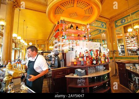 26 July 2019, Paris, France: Barman serving alcohol cocktails in retro bar. Stock Photo