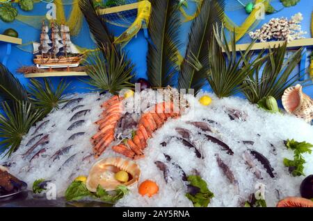 Display stands of fishes and seafoods Stock Photo - Alamy