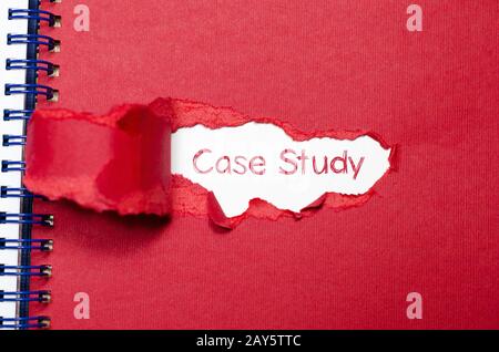 The word case study appearing behind torn paper. Stock Photo