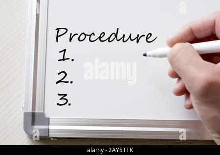 Procedure written on whiteboard Stock Photo