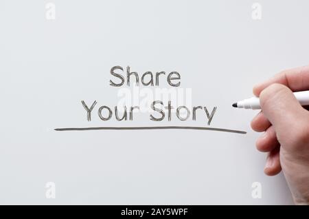 Share your story written on whiteboard Stock Photo