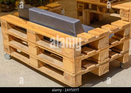 Solid wood furniture made from Euro pallets - Upcycling Möbel Stock Photo