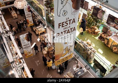 ROME, ITALY - FEBRUARY 17, 2019: Interior of Eataly food hall in Rome set for the Potato Festival with many tasty activities in the program. Stock Photo