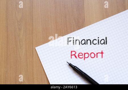 Financial report text concept on notebook Stock Photo