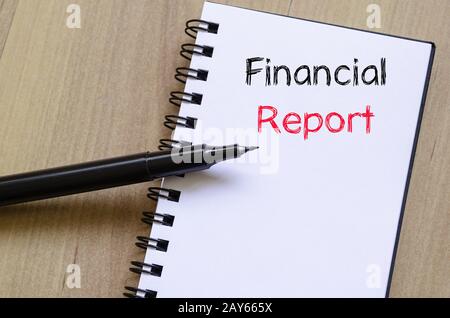 Financial report text concept on notebook Stock Photo