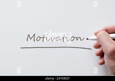Motivation written on whiteboard Stock Photo